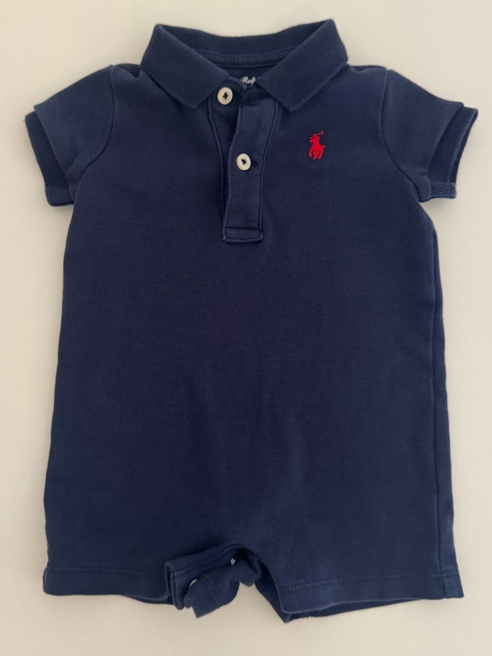 Little navy polo romper by Ralph Lauren
